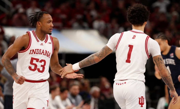 Tamar Bates (53) and guard Jalen Hood-Schifino (1) high-five during the Big Ten Men s Basketball Tournament semifinal game against the Penn State Nittany Lions,